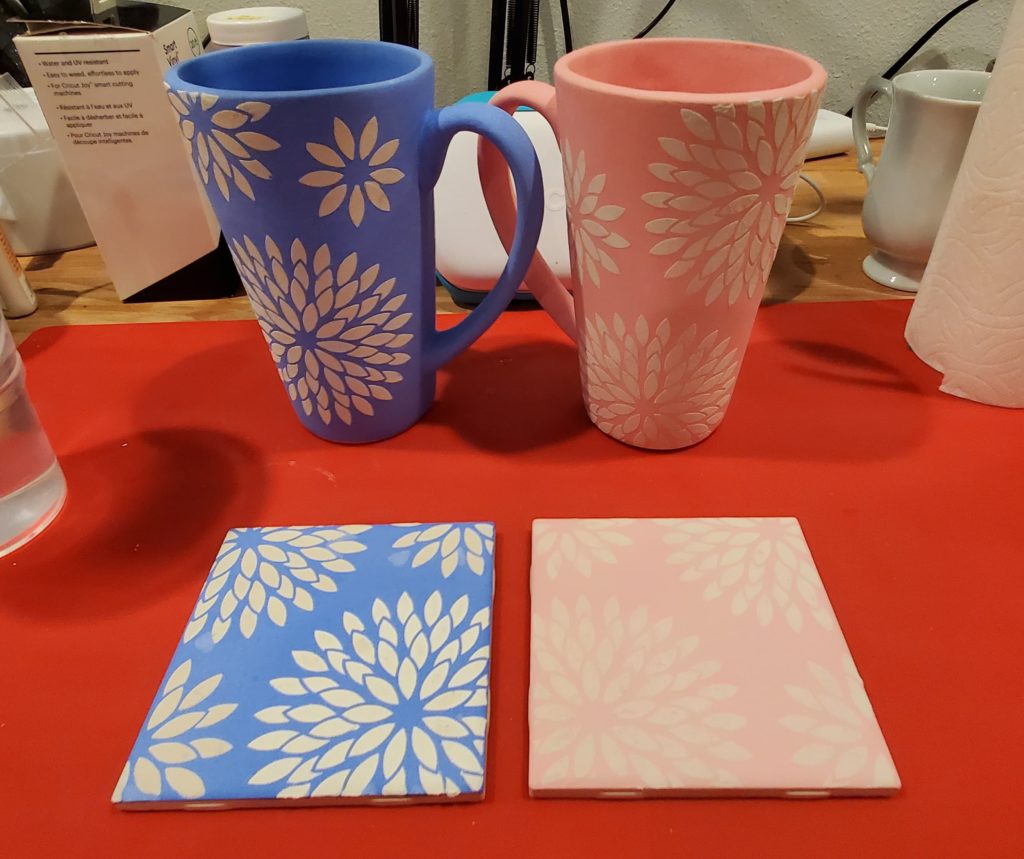 silkscreened mugs ready to be glazed