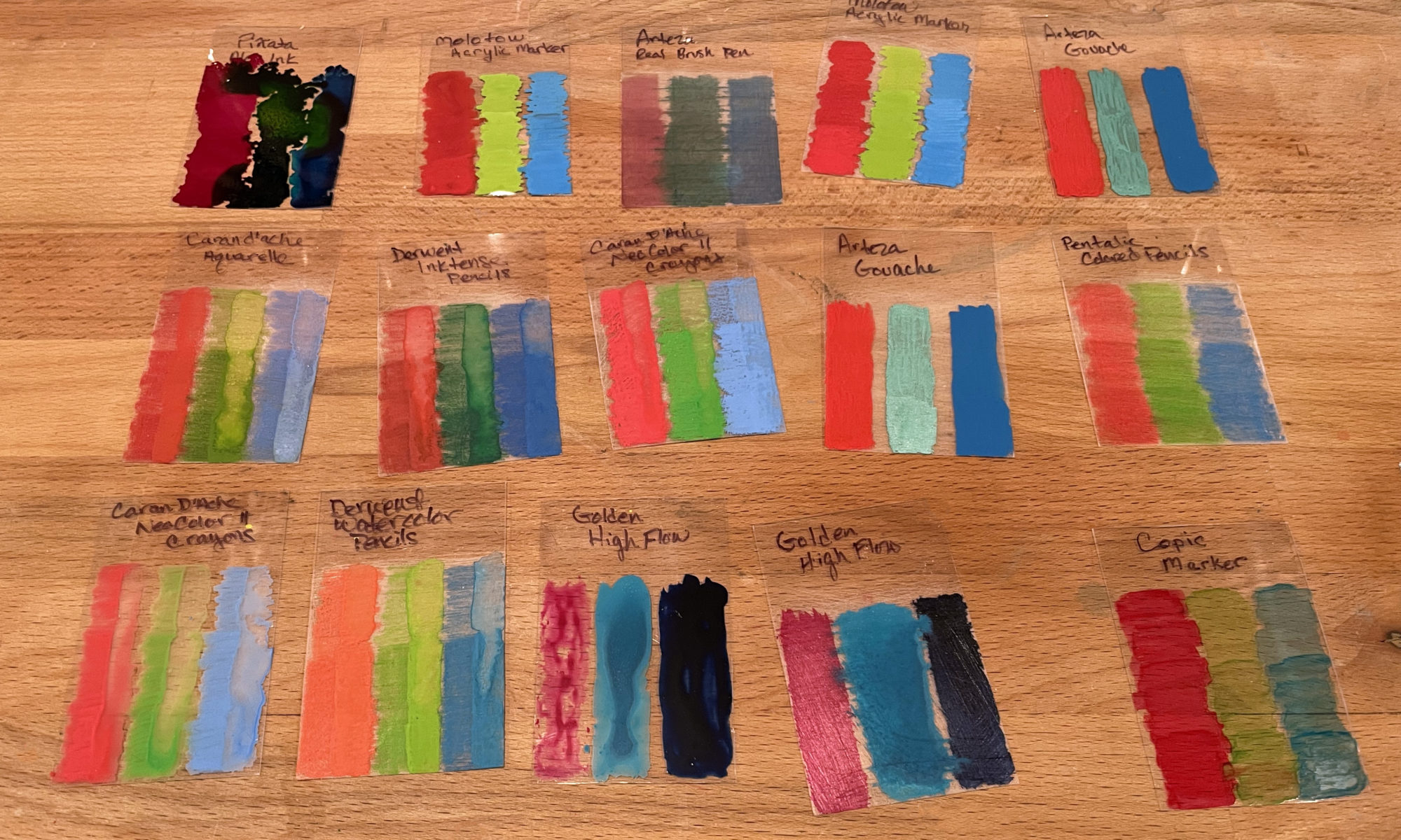 all the swatches laid out on a wooden table