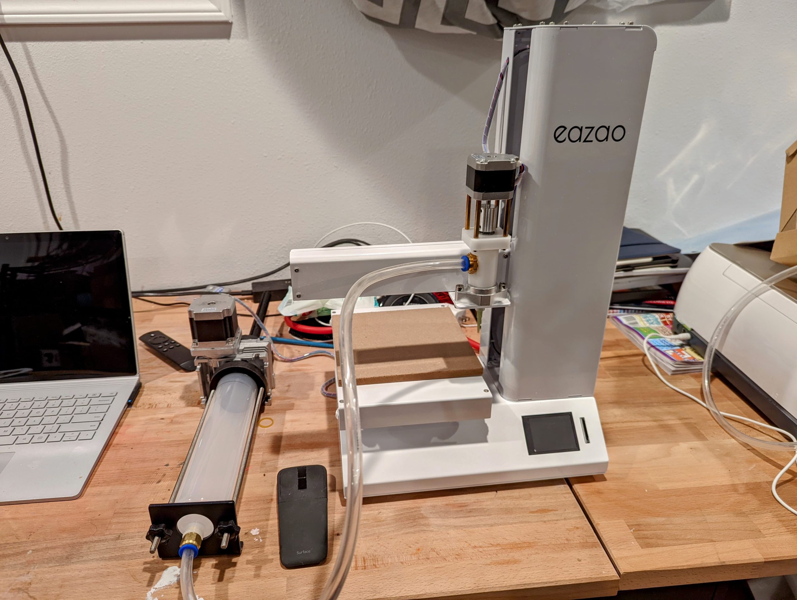 the 3d printer that has been put together and sitting on a wood table
